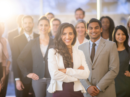 Group of people wearing suits and smiling